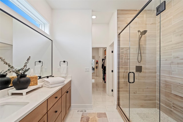 25019 Eagle Vista Dr, Adel, IA 50003 - full bathroom with double vanity, a stall shower, recessed lighting, and a spacious closet