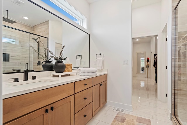 25019 Eagle Vista Dr, Adel, IA 50003 - full bathroom featuring double vanity, a shower stall, and marble finish floors