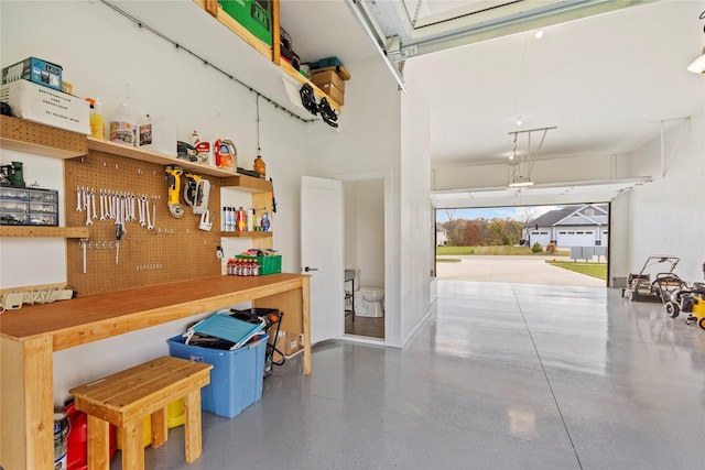 25019 Eagle Vista Dr, Adel, IA 50003 - garage featuring a workshop area