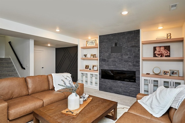25019 Eagle Vista Dr, Adel, IA 50003 - living room featuring stairs, a stone fireplace, carpet, recessed lighting, and built in features