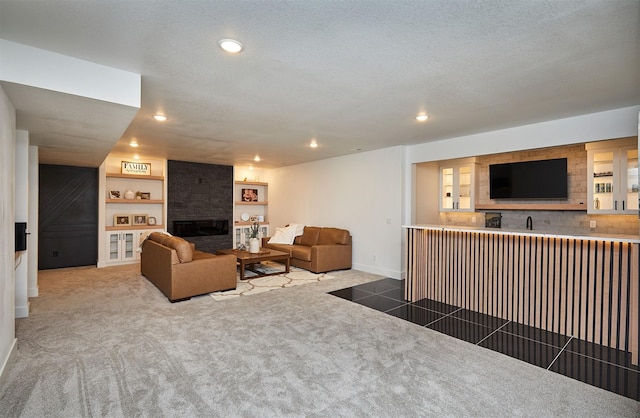25019 Eagle Vista Dr, Adel, IA 50003 - living area with carpet flooring, a large fireplace, recessed lighting, and bar