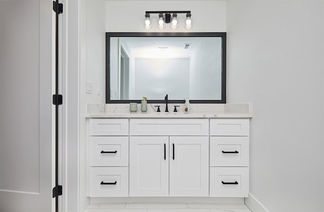 25019 Eagle Vista Dr, Adel, IA 50003 - bathroom featuring vanity and baseboards