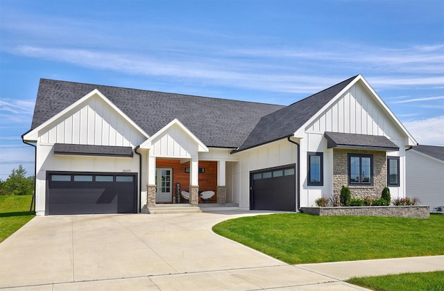 25019 Eagle Vista Dr, Adel, IA 50003 - modern farmhouse style home with stone siding, an attached garage, and driveway