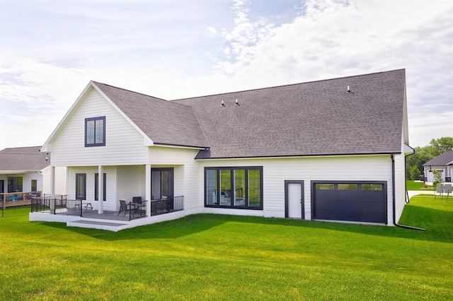 25019 Eagle Vista Dr, Adel, IA 50003 - rear view of property with roof with shingles and a yard
