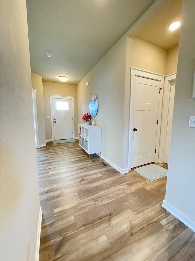 425 SE Hollow Ct, West Des Moines, IA 50265 - entryway with baseboards and wood finished floors