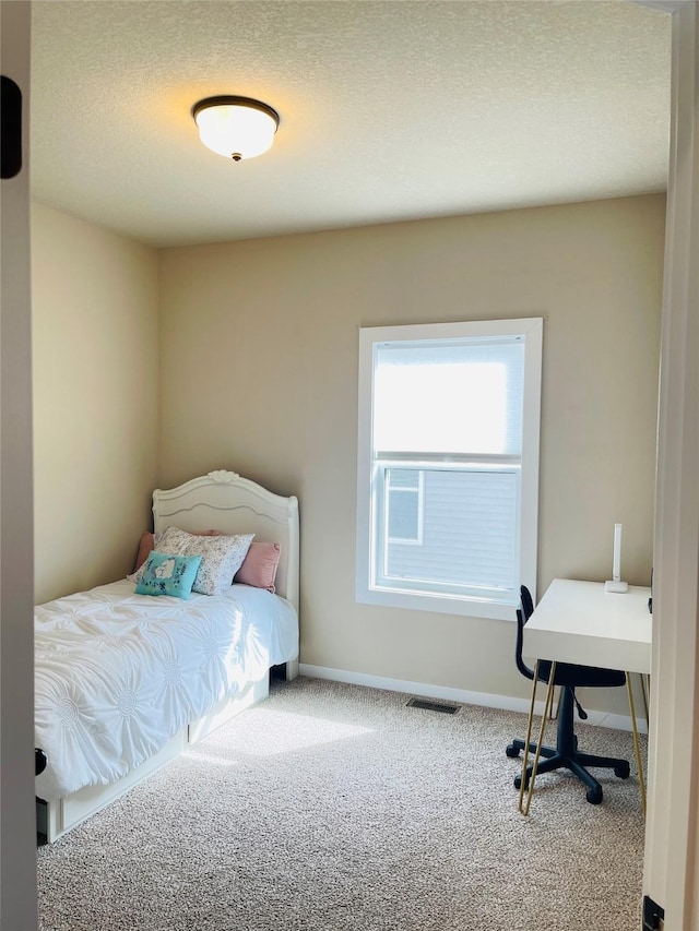 425 SE Hollow Ct, West Des Moines, IA 50265 - carpeted bedroom with a textured ceiling, baseboards, and visible vents