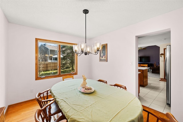 317 59th St, West Des Moines, IA 50266 - dining room with a chandelier and light wood-type flooring