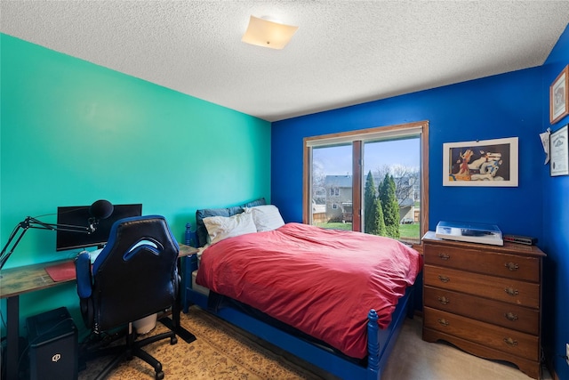 317 59th St, West Des Moines, IA 50266 - carpeted bedroom with a textured ceiling and an office area