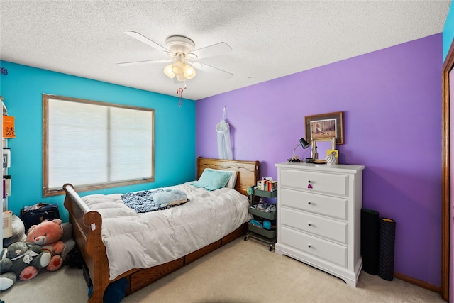 317 59th St, West Des Moines, IA 50266 - bedroom featuring light colored carpet, a ceiling fan, and a textured ceiling
