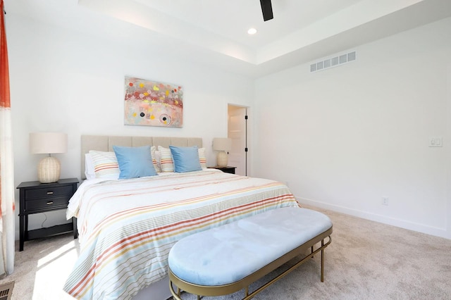 bedroom with carpet floors, a ceiling fan, visible vents, and baseboards