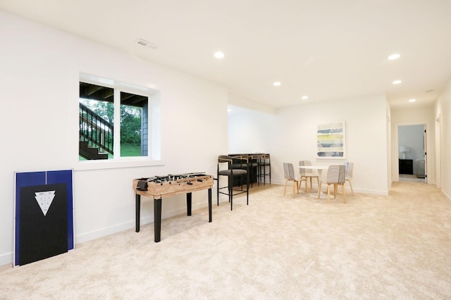 recreation room featuring carpet, baseboards, visible vents, and recessed lighting