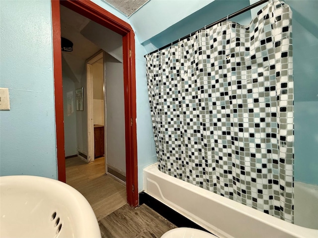 603 E Church St, Marshalltown, IA 50158 - bathroom with wood finished floors and shower / bath combo
