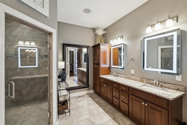 3144 Prairie Rose Dr, Norwalk, IA 50211 - bathroom with double vanity, a sink, visible vents, and a shower stall