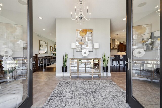 3144 Prairie Rose Dr, Norwalk, IA 50211 - entrance foyer featuring visible vents, recessed lighting, and a notable chandelier