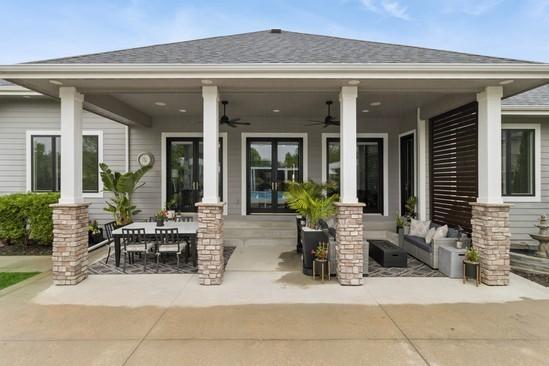 3144 Prairie Rose Dr, Norwalk, IA 50211 - rear view of house featuring a patio, ceiling fan, an outdoor hangout area, and outdoor dining space