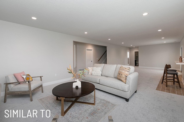 18048 Tanglewood Dr, Clive, IA 50325 - carpeted living room with recessed lighting and stairs