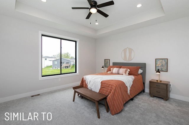 18048 Tanglewood Dr, Clive, IA 50325 - carpeted bedroom with a raised ceiling, recessed lighting, and ceiling fan