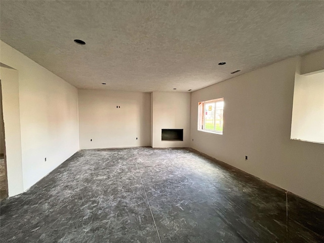 18048 Tanglewood Dr, Clive, IA 50325 - unfurnished living room with a fireplace and a textured ceiling