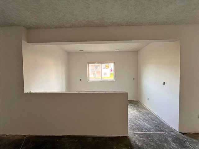 18048 Tanglewood Dr, Clive, IA 50325 - spare room featuring a textured ceiling