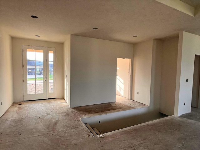 18048 Tanglewood Dr, Clive, IA 50325 - carpeted entrance foyer with a textured ceiling and recessed lighting