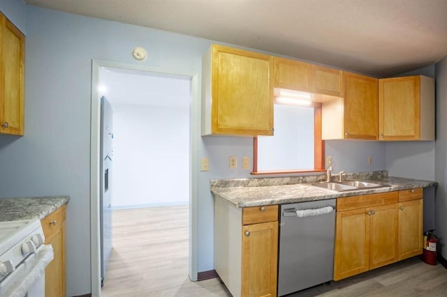 kitchen with a sink, light wood finished floors, stainless steel dishwasher, baseboards, and white gas stove