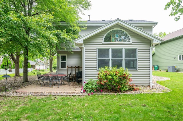 4774 Coachlight Dr, West Des Moines, IA 50265 - back of property featuring a yard, central AC, and a patio area