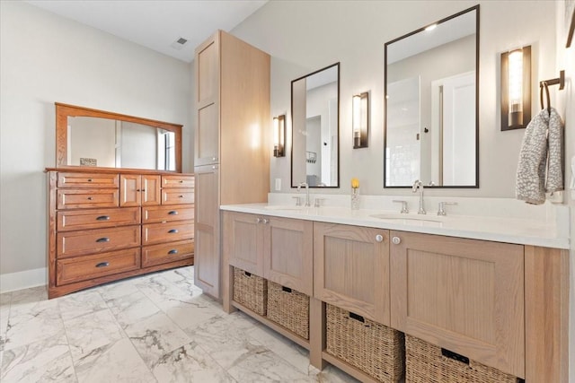 1645 SW Magazine Rd Unit 102, Ankeny, IA 50023 - bathroom featuring double vanity and marble look tile flooring