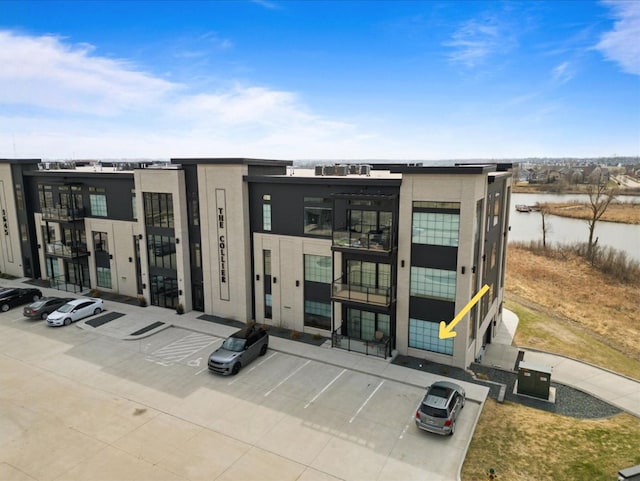 1645 SW Magazine Rd Unit 102, Ankeny, IA 50023 - view of property featuring uncovered parking and a water view