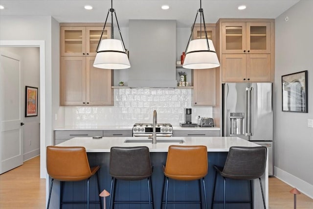 1645 SW Magazine Rd Unit 102, Ankeny, IA 50023 - kitchen with high quality fridge, light countertops, tasteful backsplash, light wood finished floors, and recessed lighting