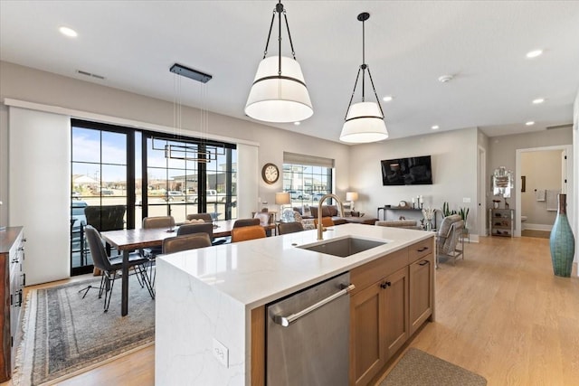 1645 SW Magazine Rd Unit 102, Ankeny, IA 50023 - kitchen featuring stainless steel dishwasher, pendant lighting, open floor plan, light wood-type flooring, and recessed lighting