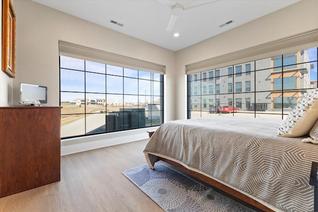 1645 SW Magazine Rd Unit 102, Ankeny, IA 50023 - bedroom with wood finished floors and recessed lighting