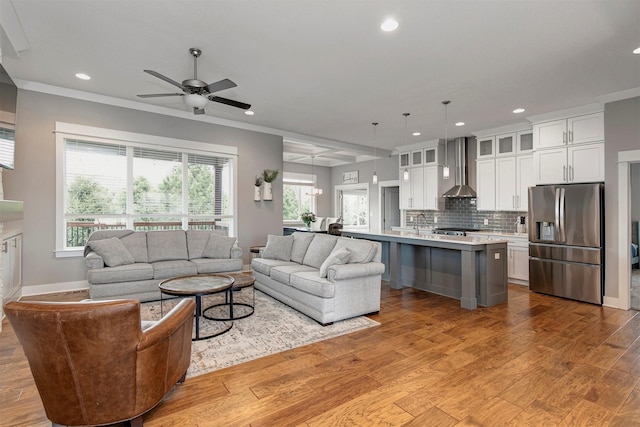 16206 Brookview Dr, Urbandale, IA 50323 - living area featuring recessed lighting, a ceiling fan, light wood finished floors, baseboards, and crown molding
