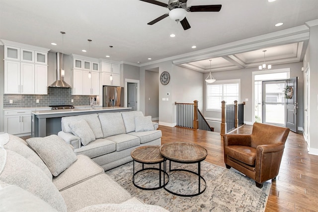 16206 Brookview Dr, Urbandale, IA 50323 - living area with recessed lighting, baseboards, light wood-style floors, ceiling fan, and crown molding