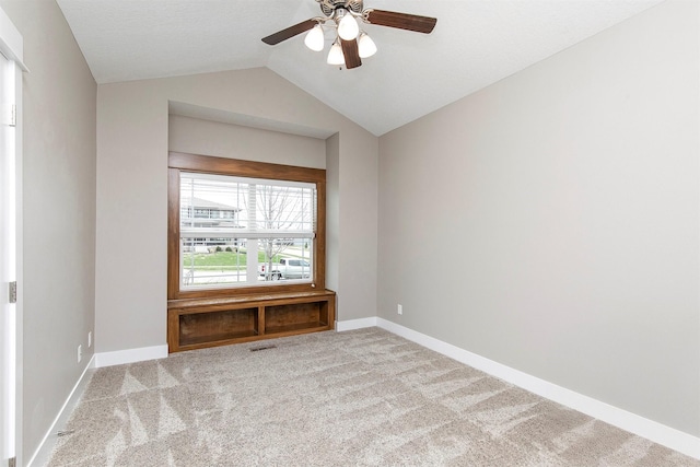 16206 Brookview Dr, Urbandale, IA 50323 - empty room with lofted ceiling, carpet floors, a ceiling fan, and baseboards
