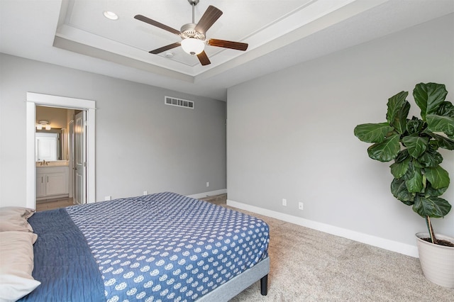 16206 Brookview Dr, Urbandale, IA 50323 - bedroom with a raised ceiling, baseboards, carpet floors, and ensuite bathroom