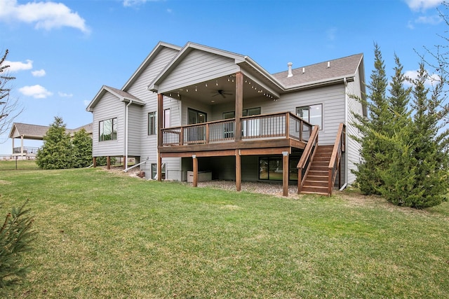16206 Brookview Dr, Urbandale, IA 50323 - back of house with a ceiling fan, stairway, a deck, and a yard