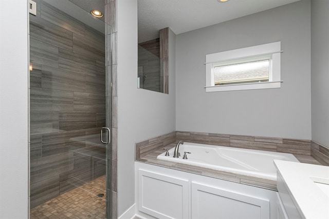 16206 Brookview Dr, Urbandale, IA 50323 - bathroom featuring a bath, a stall shower, and recessed lighting