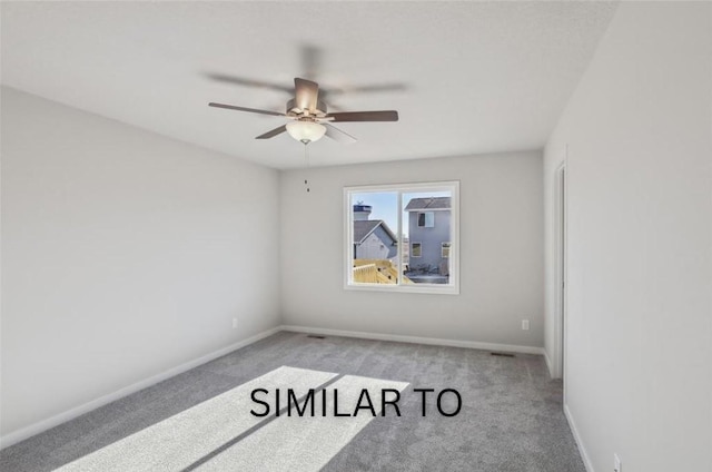 carpeted empty room with baseboards and ceiling fan