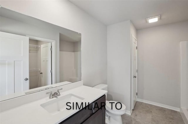 full bath with baseboards, toilet, and vanity