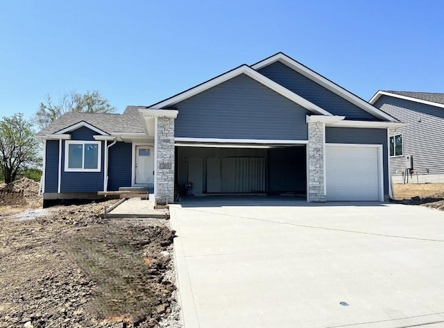 201 S Walnut Dr, Norwalk, IA 50211 - single story home featuring a garage, driveway, and a shingled roof