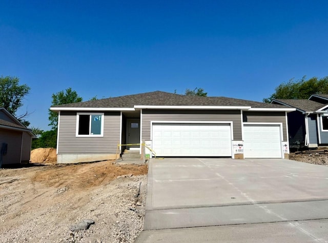 207 S Walnut Dr, Norwalk, IA 50211 - ranch-style home featuring a garage and driveway