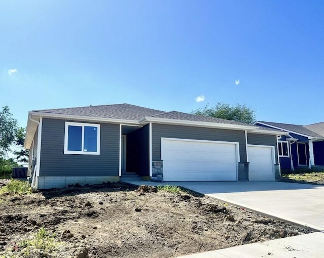 207 S Walnut Dr, Norwalk, IA 50211 - ranch-style house with an attached garage and concrete driveway