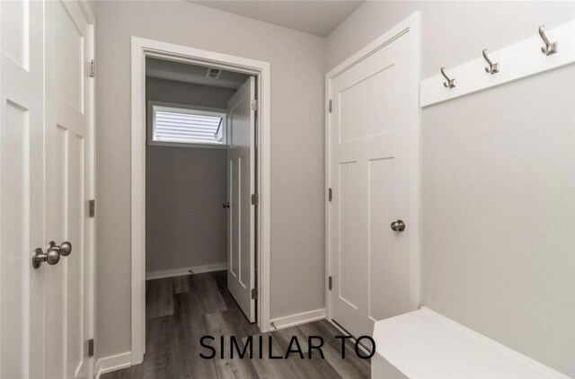 213 S Walnut Dr, Norwalk, IA 50211 - mudroom featuring dark wood-style flooring and baseboards