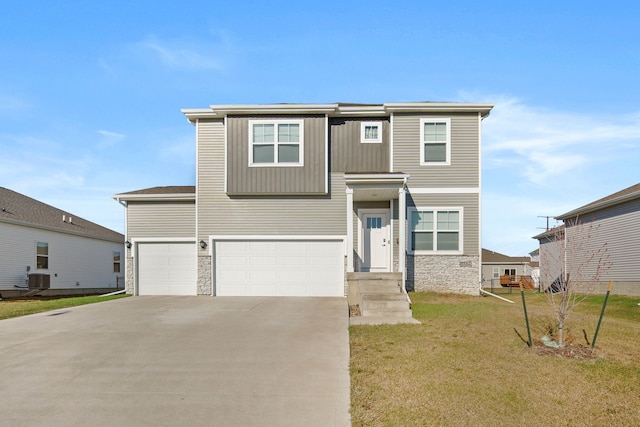 traditional home with stone siding, an attached garage, concrete driveway, a front yard, and central air condition unit
