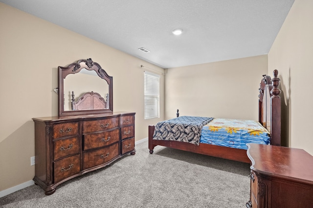 bedroom featuring carpet floors and baseboards