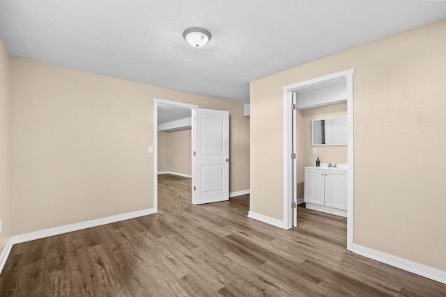 5506 145th St, Urbandale, IA 50323 - spare room with wood finished floors and baseboards