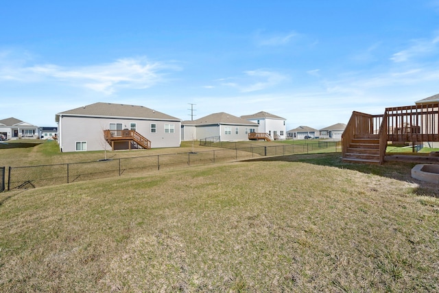 5506 145th St, Urbandale, IA 50323 - fenced backyard with stairs, a deck, and a residential view