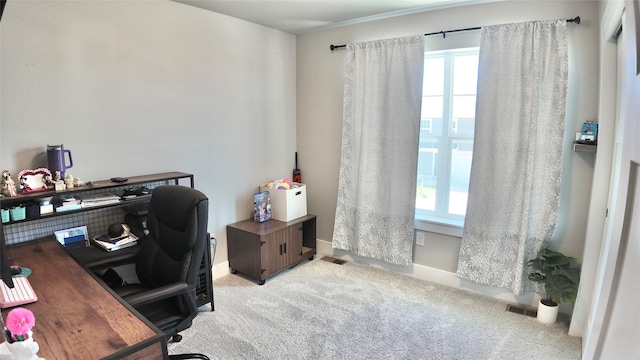 office space with light carpet and baseboards