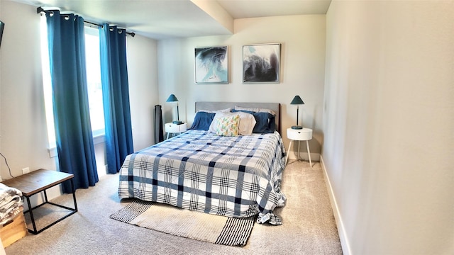bedroom with carpet flooring and baseboards
