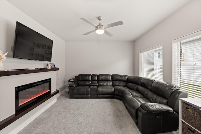 17127 Blue Sage Ln, Urbandale, IA 50323 - living area with a ceiling fan, carpet, and a glass covered fireplace